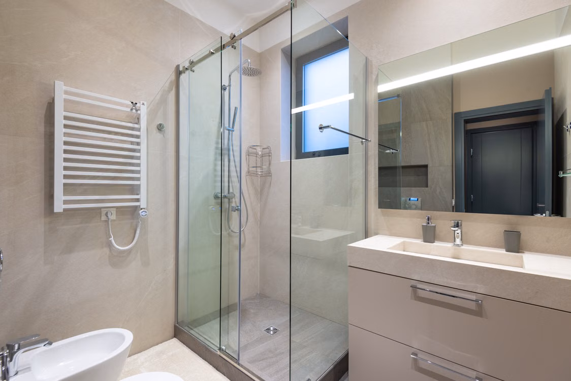 Frameless glass shower enclosure — illustrative stock design reference